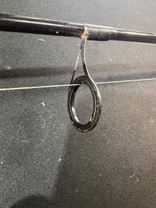 Top of the eye is touching the line with the reel in First Position